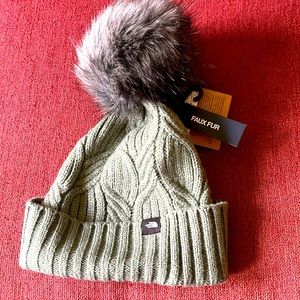 Youth North Face hat with large faux fur Pom Pom.